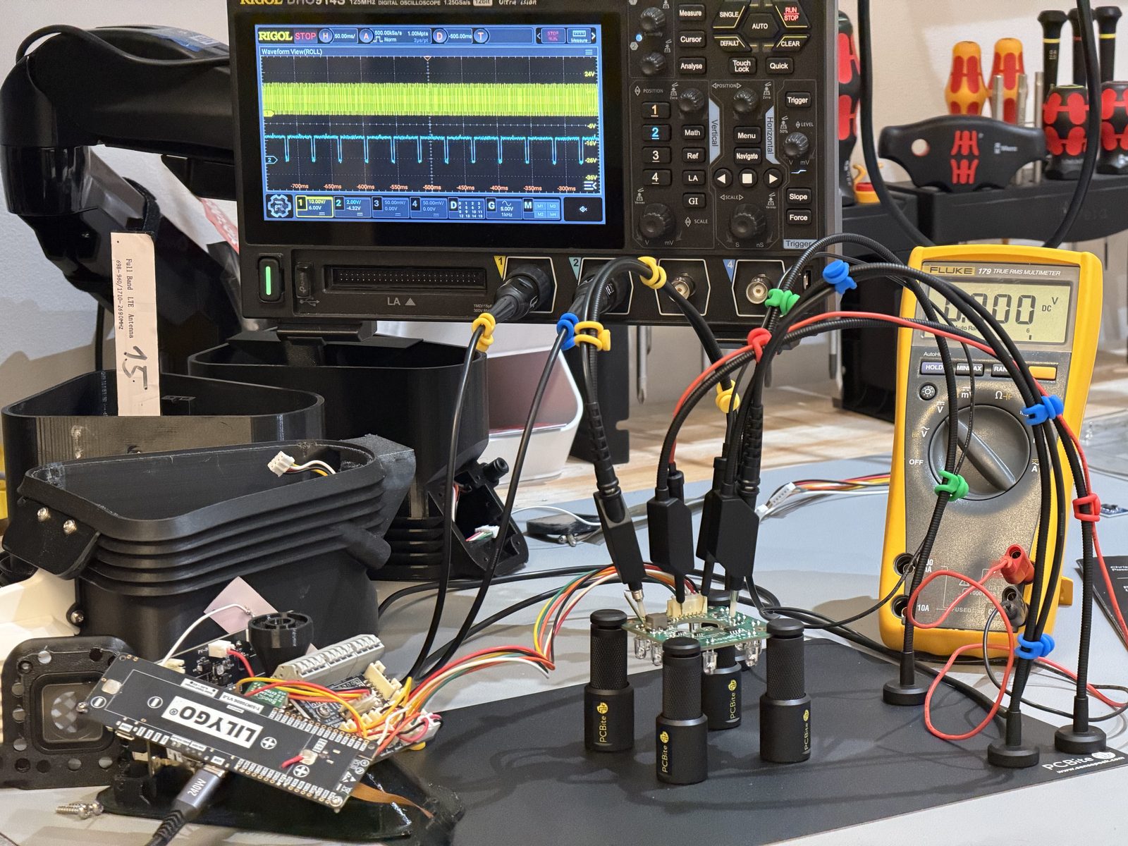 Oscilloscope, multimeter and probes on the bench